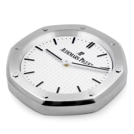 Close-up of Bwatch luxury wall clock showing brushed steel finish and markers