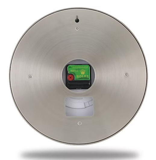 Rolex Back view of rose-gold fluted bezel wall clock showing battery compartment, stainless steel casing, and wall-mount design