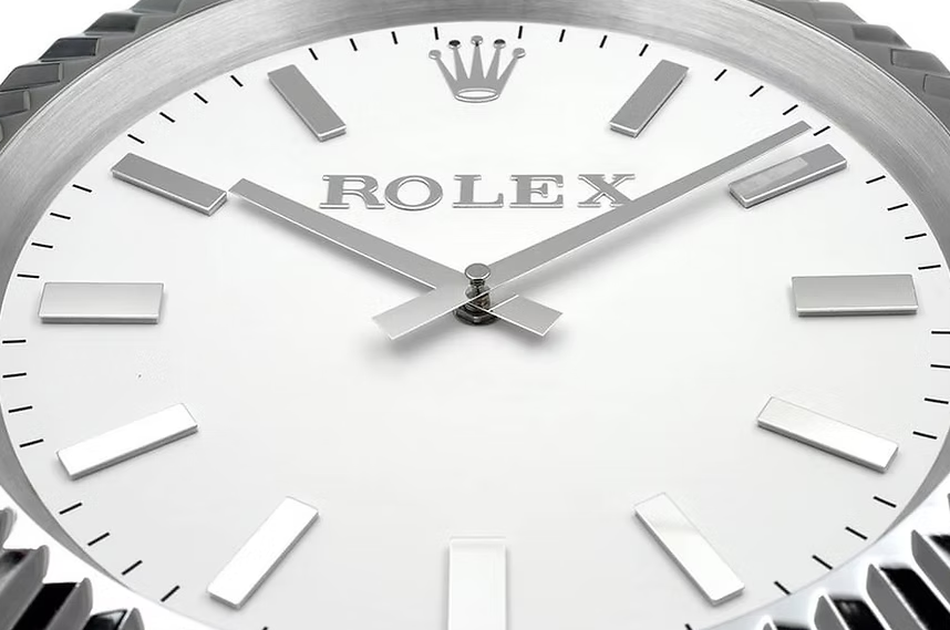 Rolex Luxury stainless steel wall clock featuring luminous markers and sweeping movement