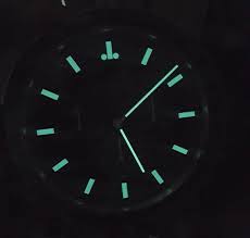 BWATCHE Moonwatch wall clock glowing dial with luminous markers in low light